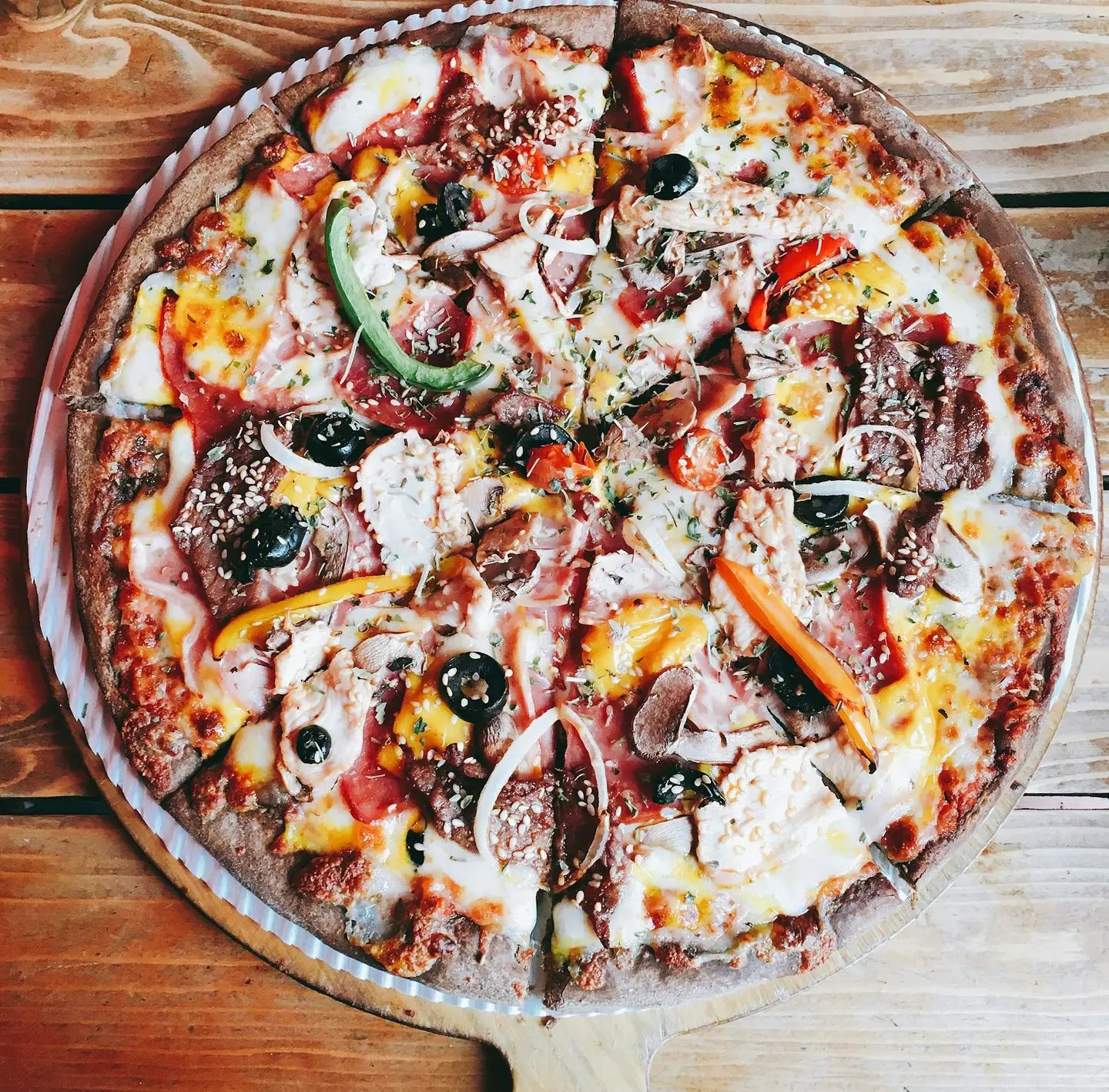 pizza with green and red bell pepper and cheese